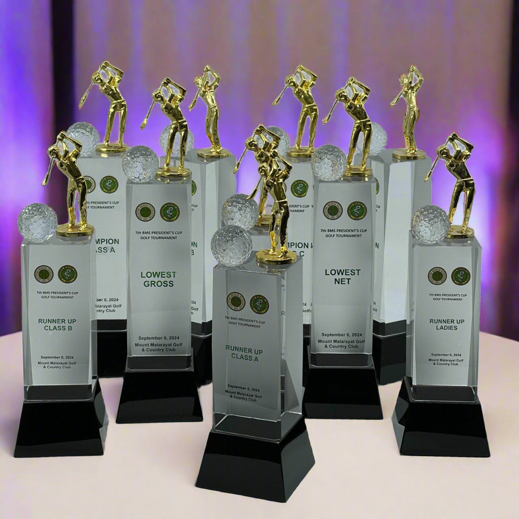 Set of golf trophies with gold figures on a white background