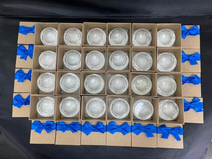 Cardboard boxes with crystal desk trophies blue ribbons on a black background 