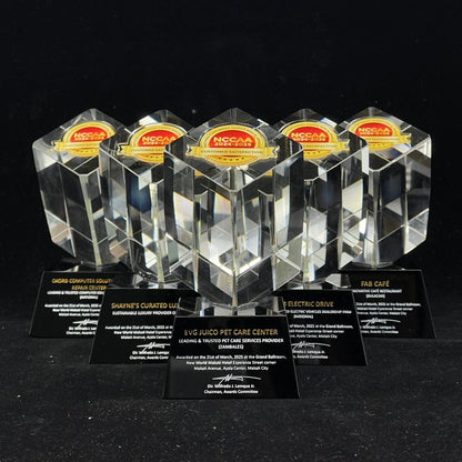 Set of crystal awards with black stands on a dark background